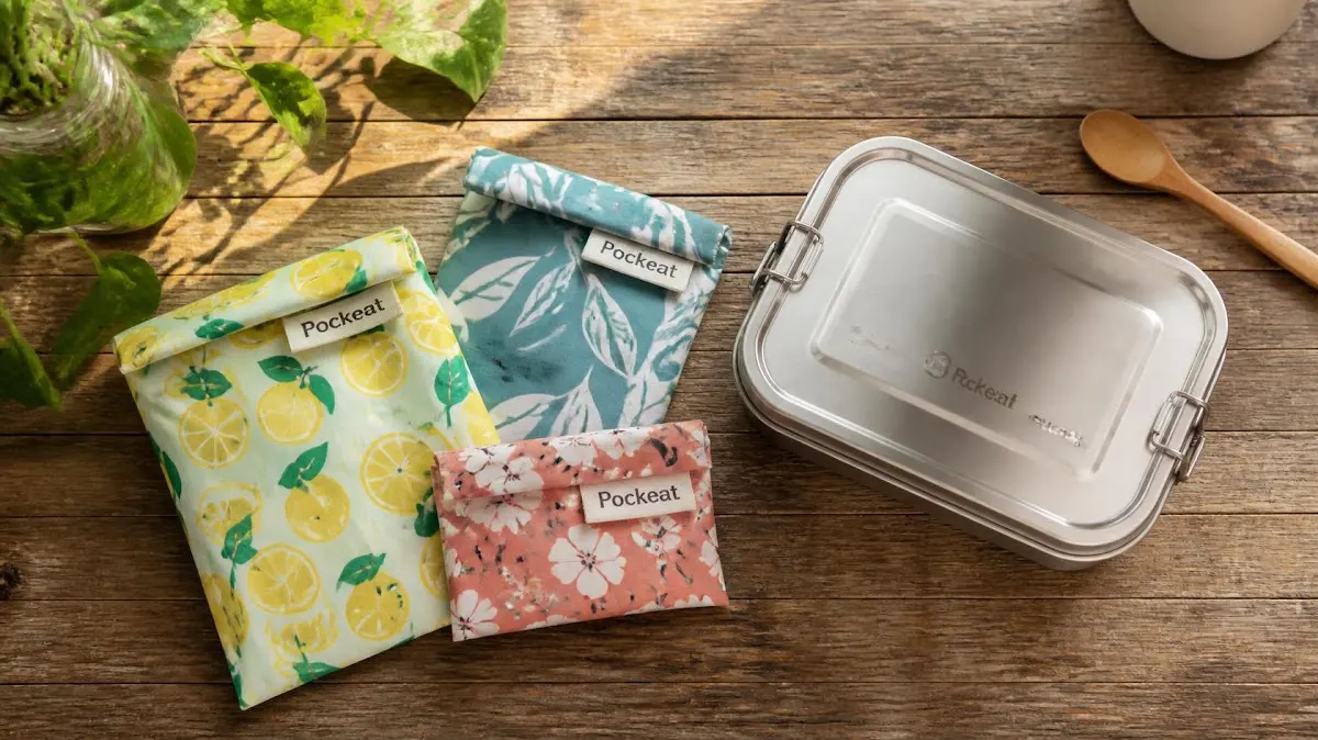 Reusable cloth snack bags on wooden counter